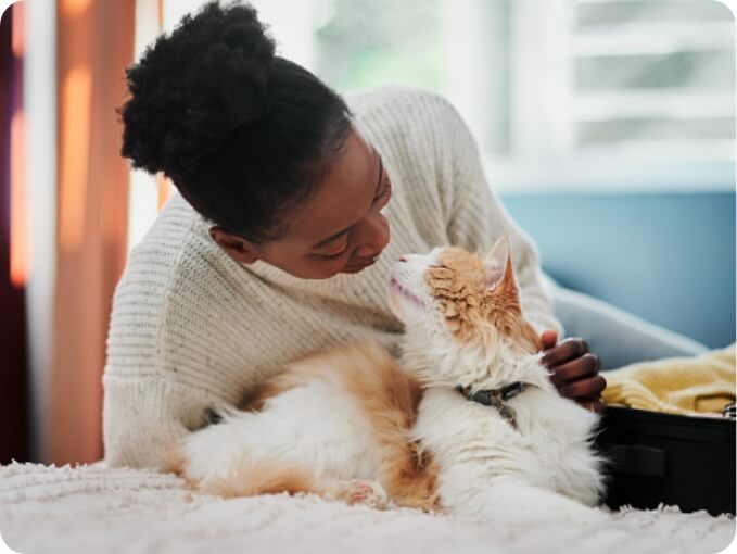 A Girl and Her Cat Look at Each Other | FRONTLINE® Flea and Tick Protection